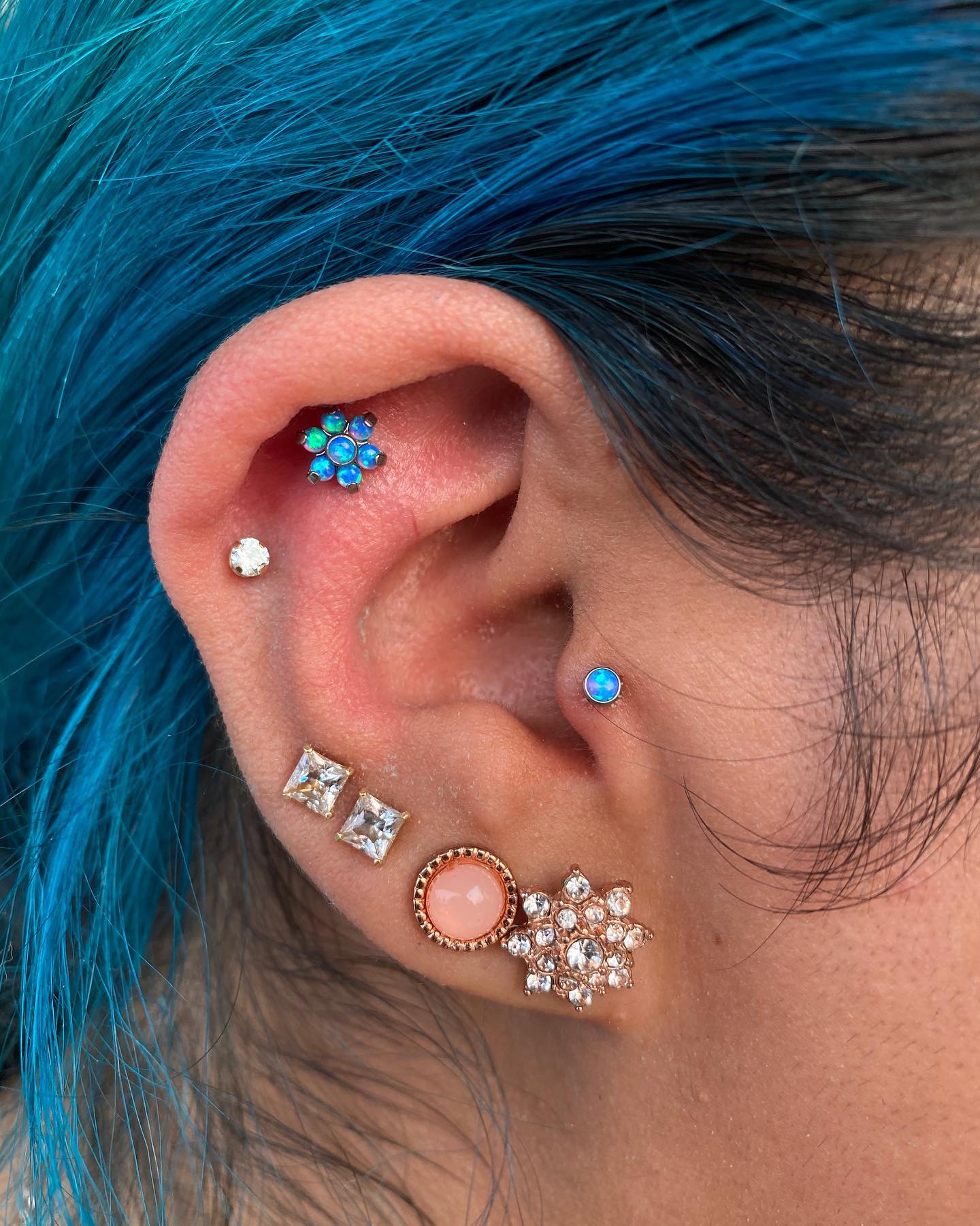 Discover stunning curated ear piercings featuring cartilage and lobe placements. See gemstone studs, hoops, and statement pieces for every style.