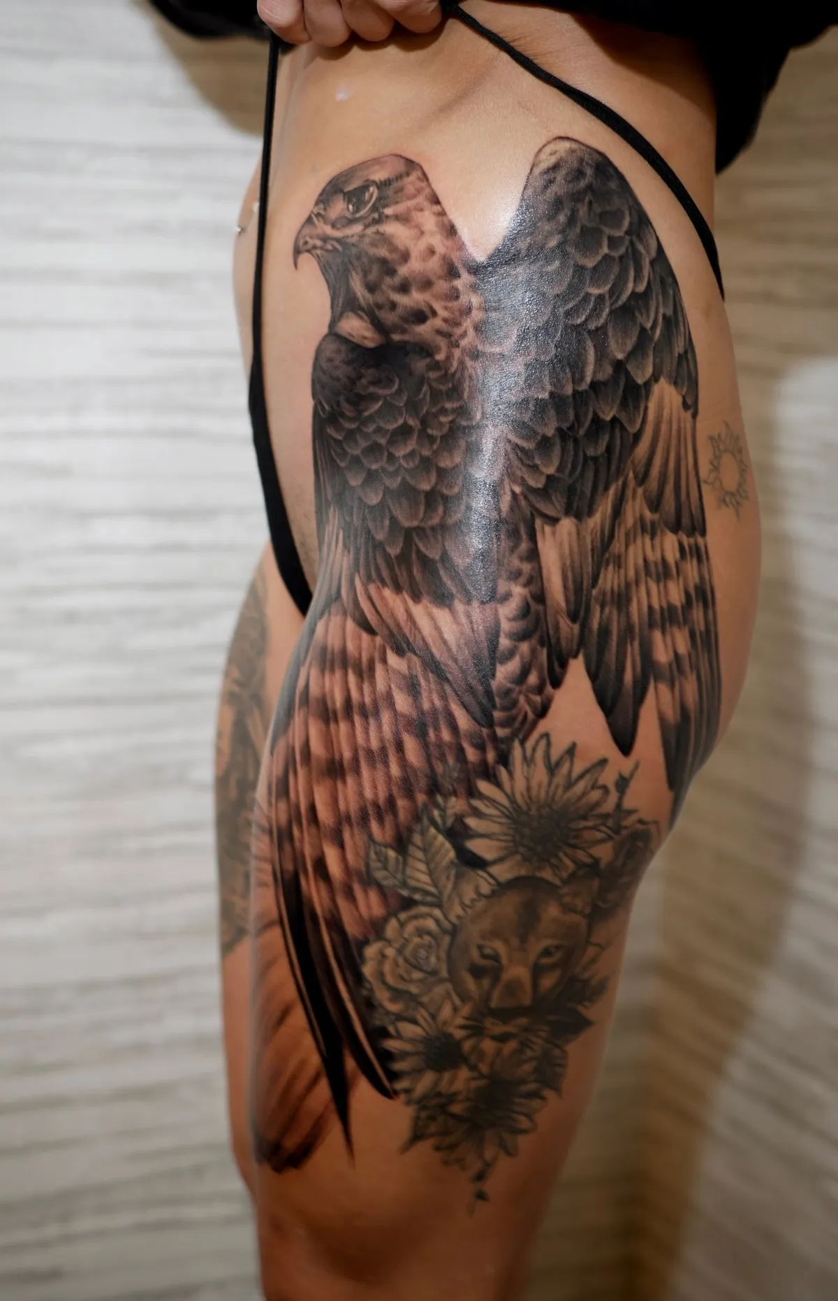 Black and grey realism hawk tattoo by Olivia Thompson at Golden Child Tattoo in Escondido