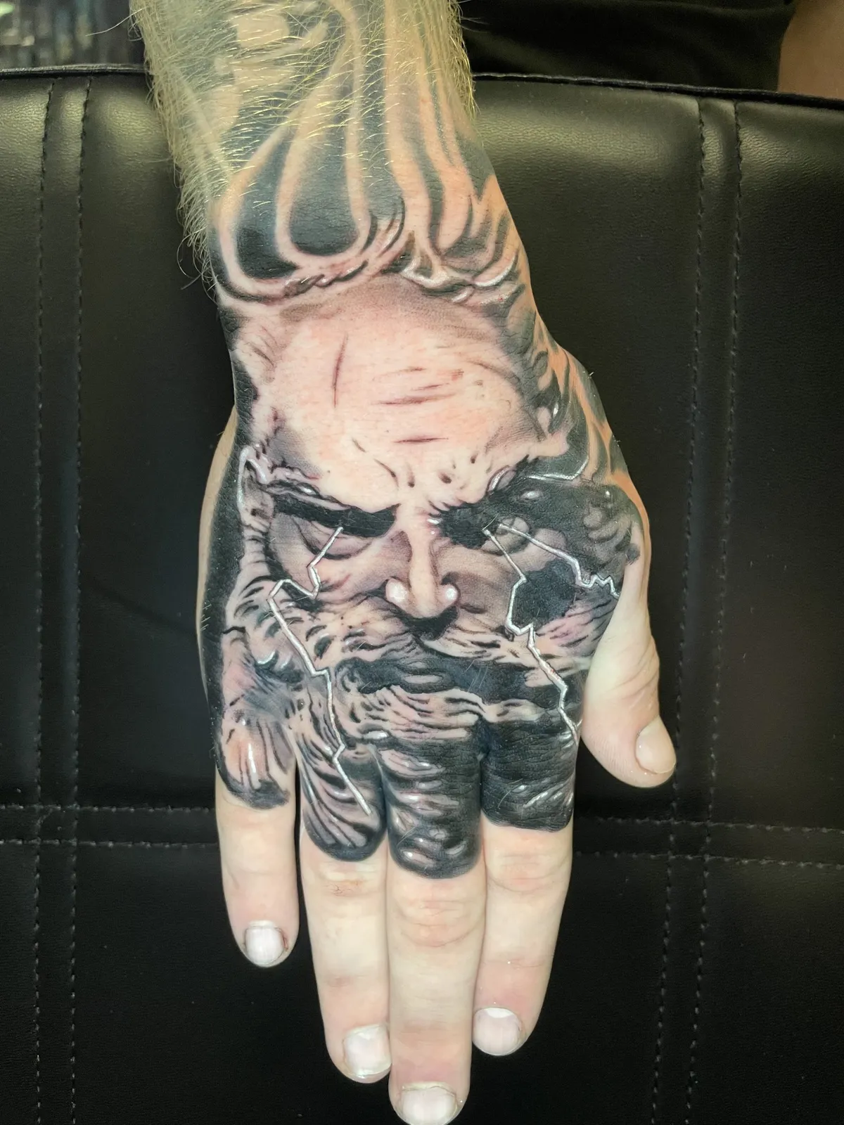 Black & gray realism Zeus tattoo
