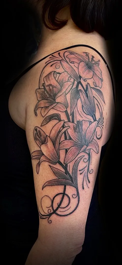 Feminine tattoo by Kurt (Tatzilla) at Golden Child Tattoo in Escondido