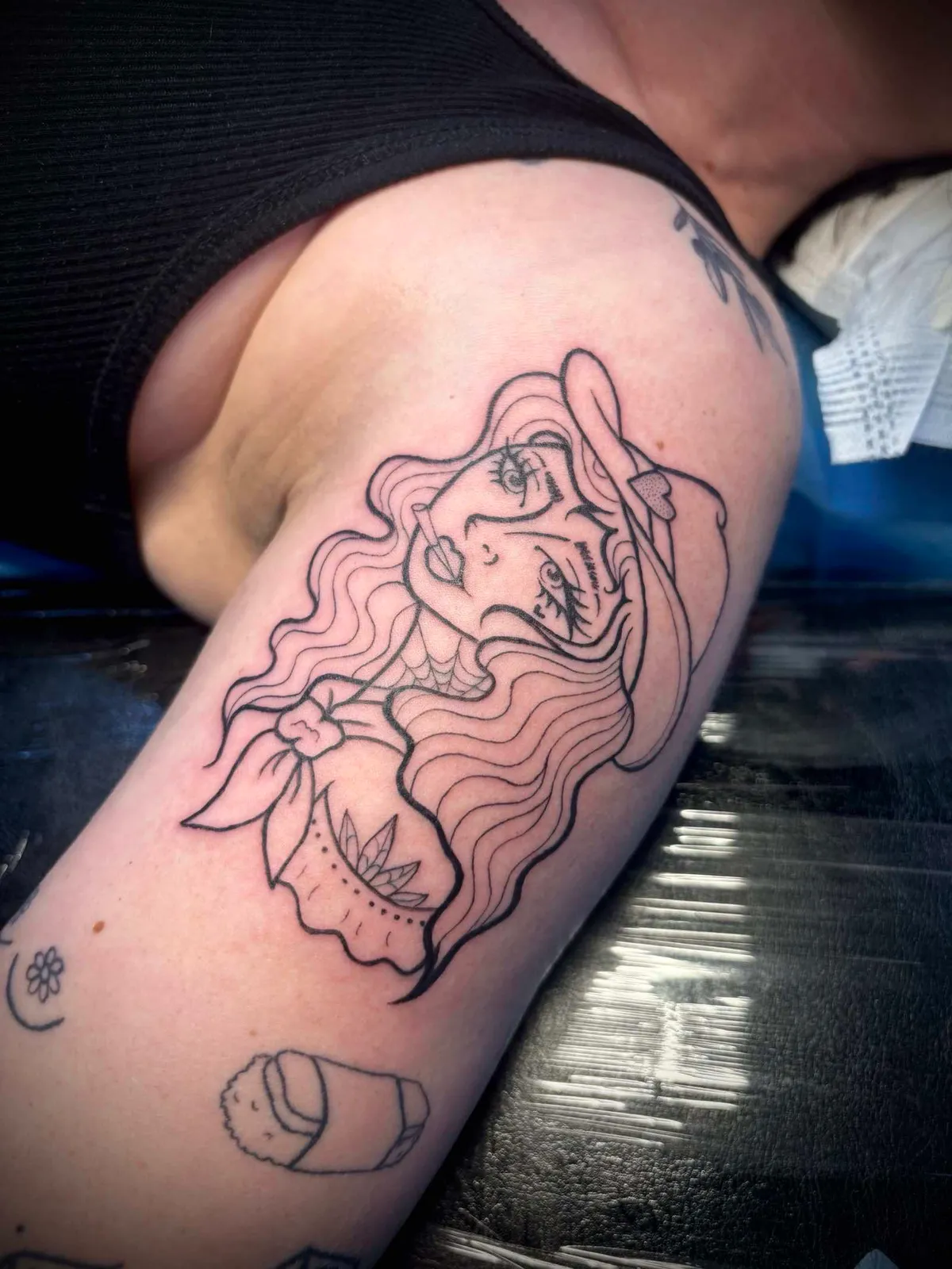 Illustrative tattoo by Melissa at Golden Child Tattoo in Escondido