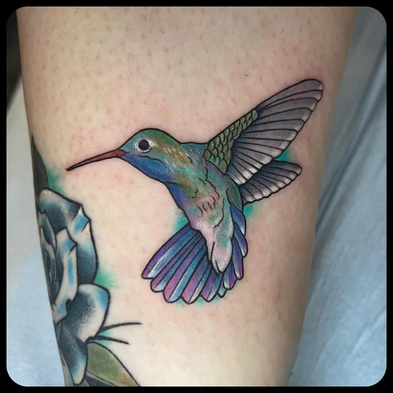 Realistic / watercolor hummingbird tattoo