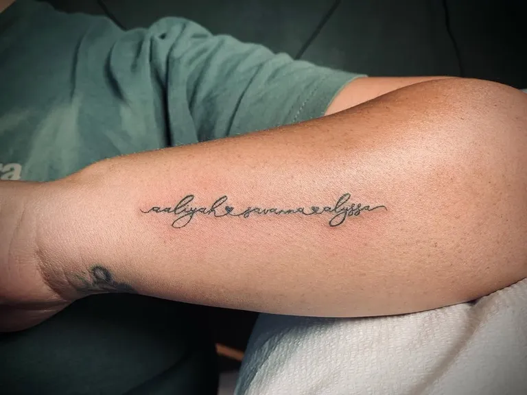 Fine line script tattoo along the inner forearm by Melissa at Golden Child Tattoo in Escondido