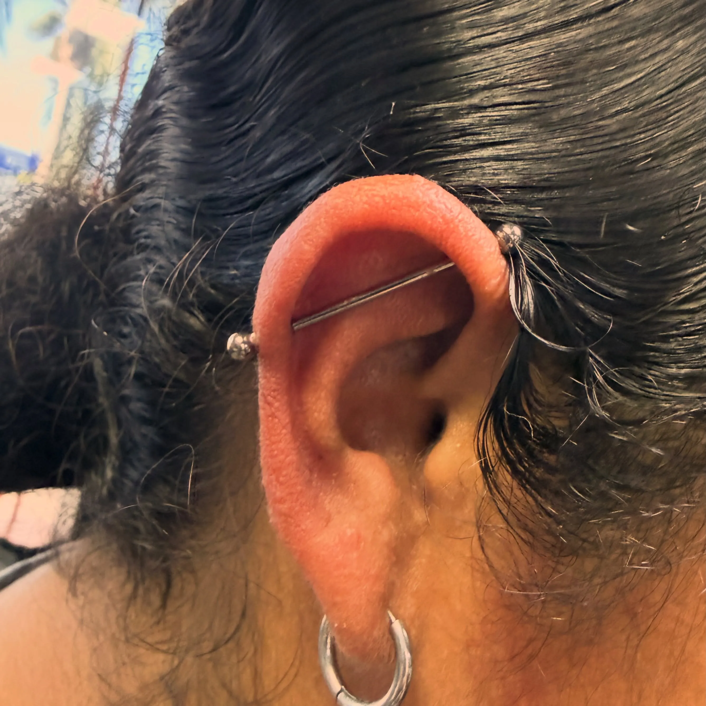 Industrial piercing by Wheels at Golden Child Tattoo in Escondido