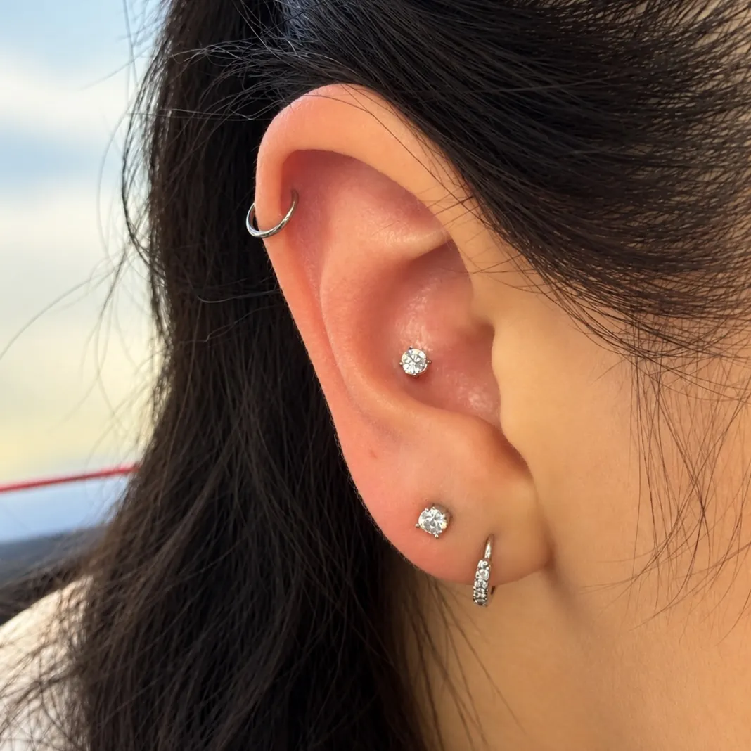 Conch piercing by Wheels at Golden Child Tattoo in Escondido