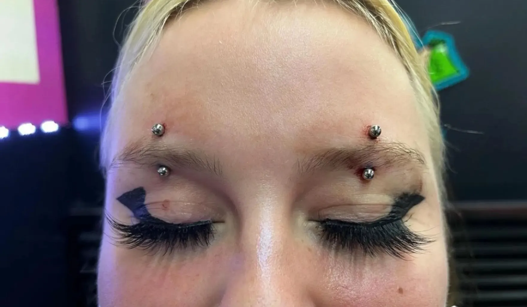 Double eyebrow piercing by Wheels at Golden Child Tattoo in Escondido
