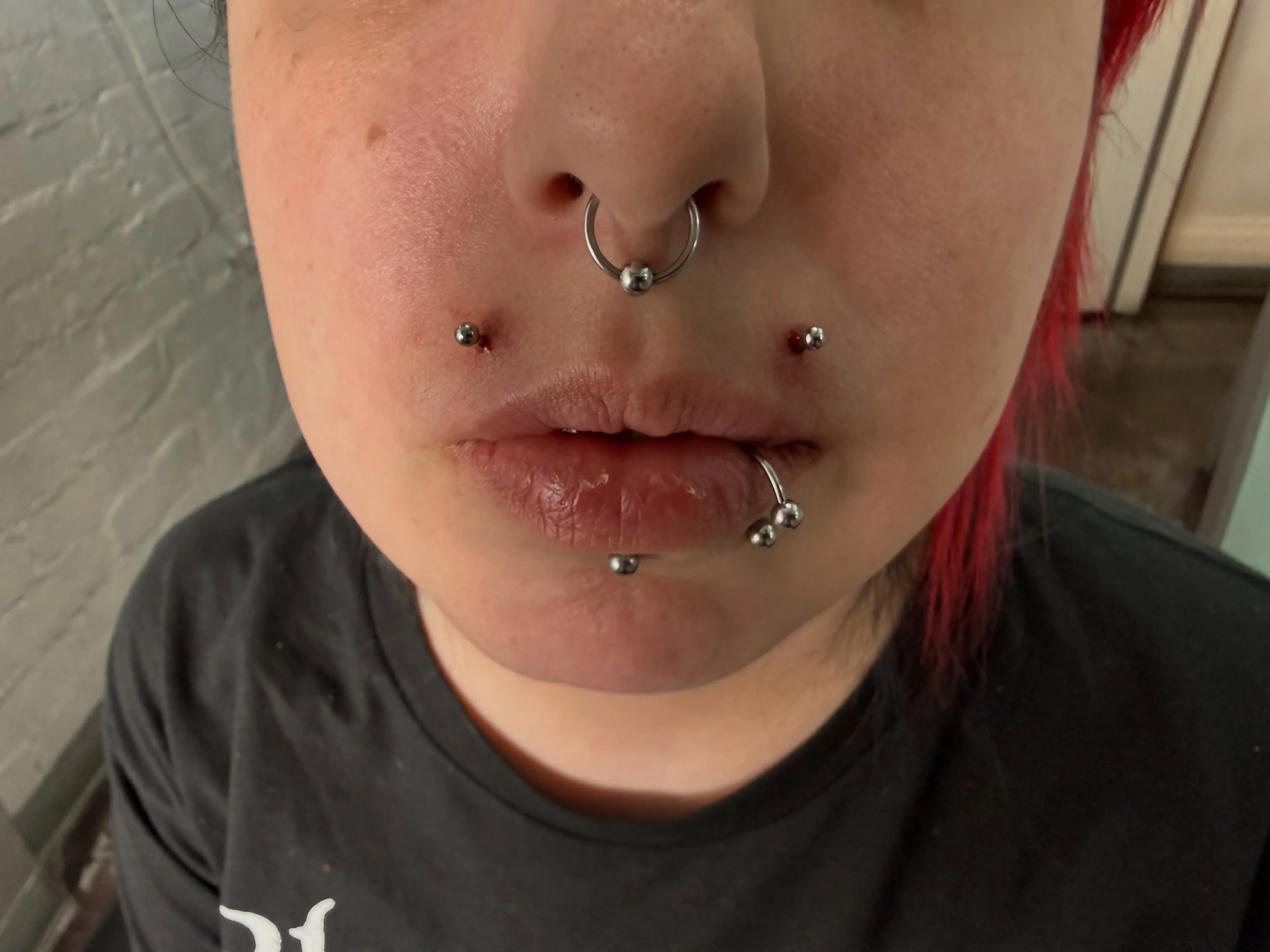Double Monroe piercing by Wheels at Golden Child Tattoo in Escondido