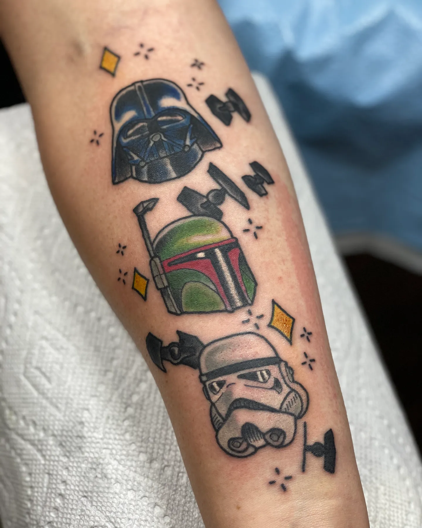 Star Wars helmets tattoo of Darth Vader, Boba Fett and a stormtrooper by Mathias Moretti at Golden Child Tattoo in Escondido