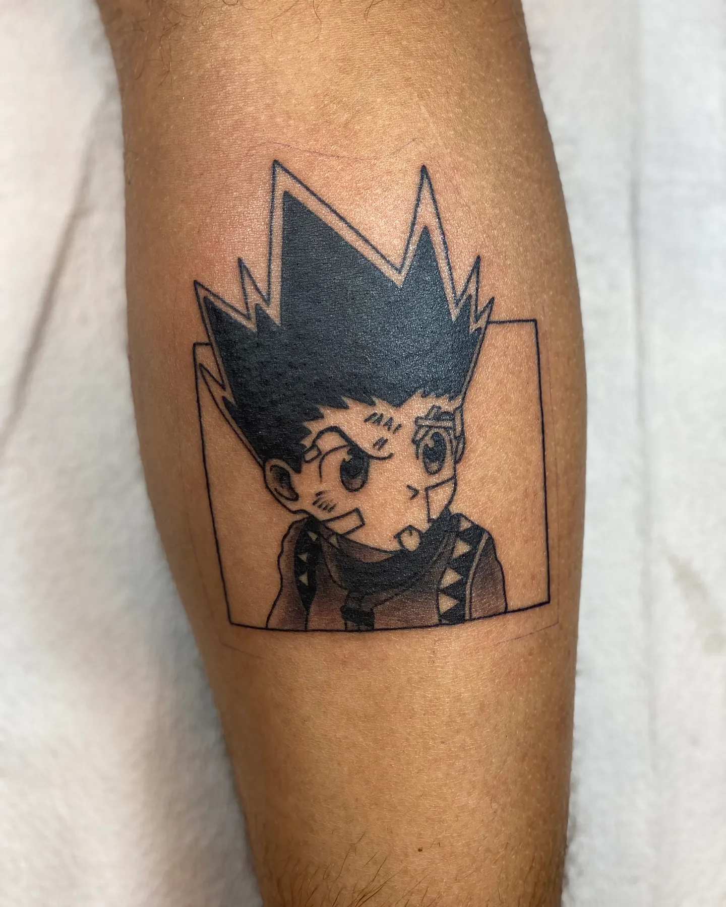 Anime character portrait tattoo in a square frame by Mathias Moretti at Golden Child Tattoo in Escondido