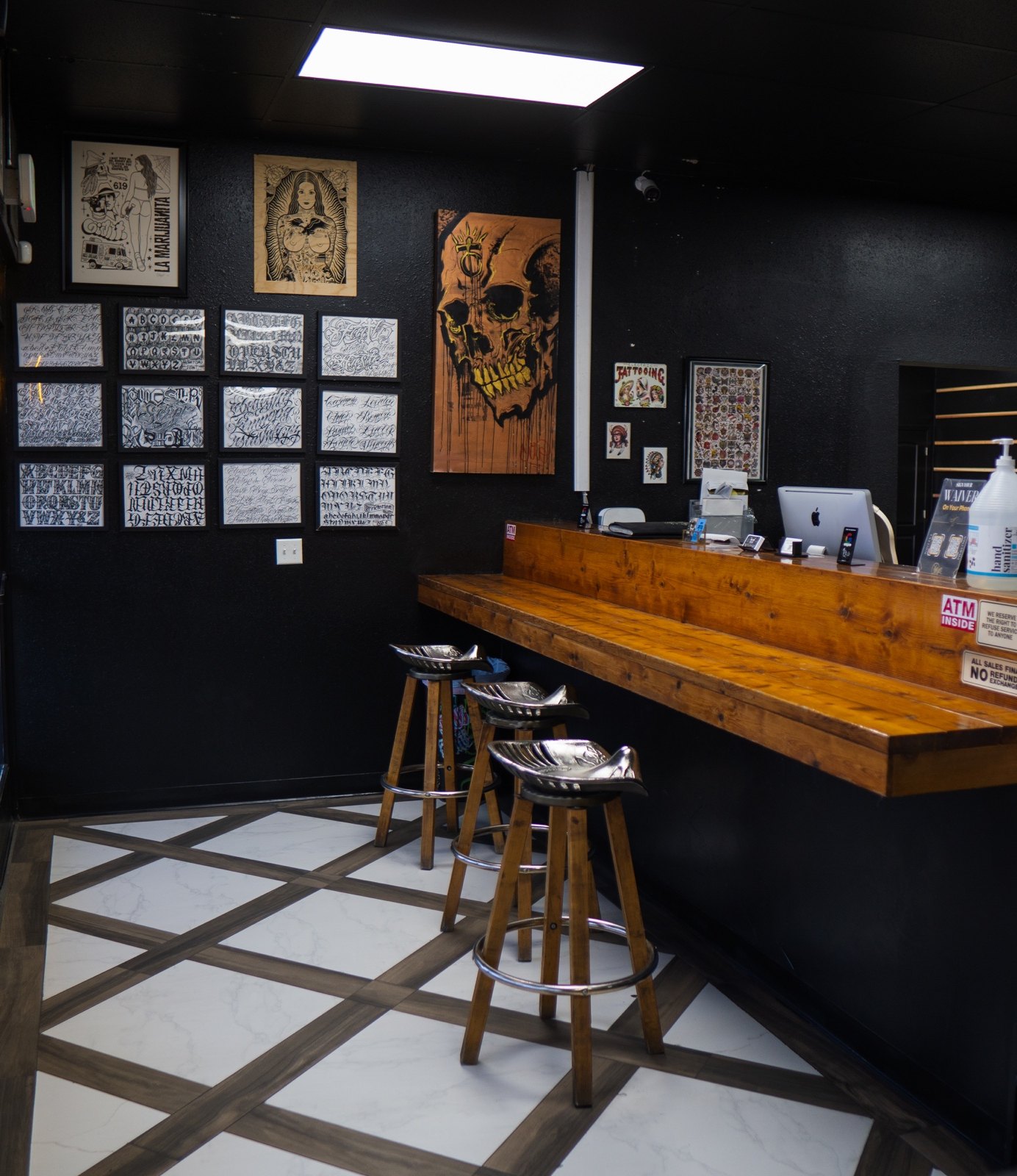 Front counter inside Golden Child Tattoo and Piercing in Escondido
