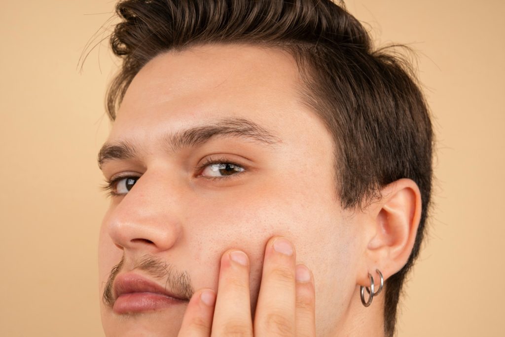 Man with small hoop earrings